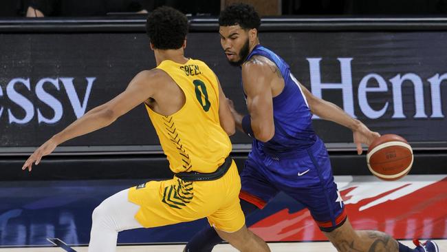 Jayson Tatum from the US faces Josh Green in a lead-up game to Tokyo.