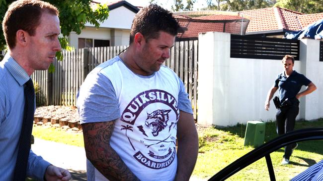 Joshua Thornbury is taken away by police after a raid. Pic: David Clark