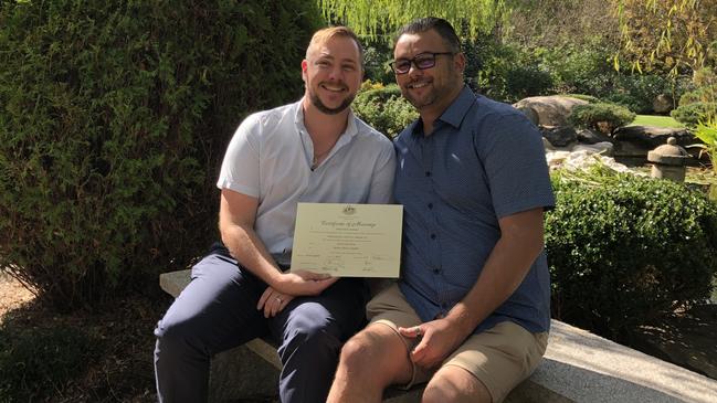 Correctional services officer Stewart Iain Berry, left, and his husband Mathew Campbell, right, on their wedding day. Picture: Supplied.