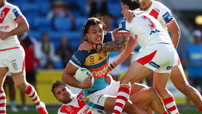 Tino Fa'asuamaleaui is brought down by three Dragons. Picture: Getty Images