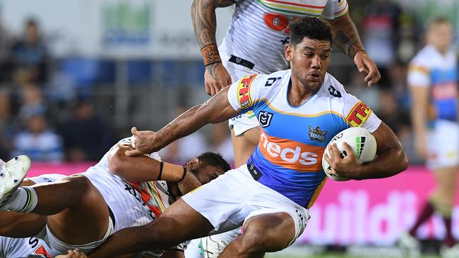 Brian Kelly of the Titans takes the bal forward during the Round 5 NRL match between the Gold Coast Titans and the Penrith Panthers at CBUS Stadium on the Gold Coast, Friday, April 12, 2019. (AAP Image/Dave Hunt) NO ARCHIVING, EDITORIAL USE ONLY