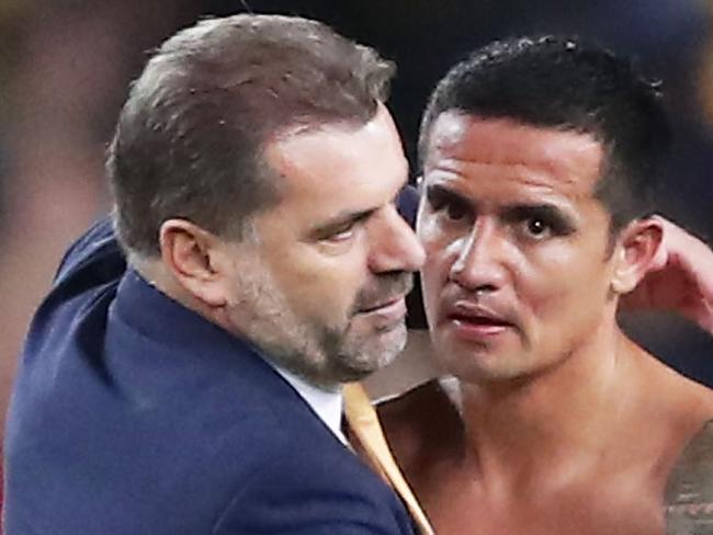 SYDNEY, AUSTRALIA - OCTOBER 10:  Tim Cahill of Australia celebrates victory with Australia Coach Ange Postecoglou during the 2018 FIFA World Cup Asian Playoff match between the Australian Socceroos and Syria at ANZ Stadium on October 10, 2017 in Sydney, Australia.  (Photo by Matt King/Getty Images)