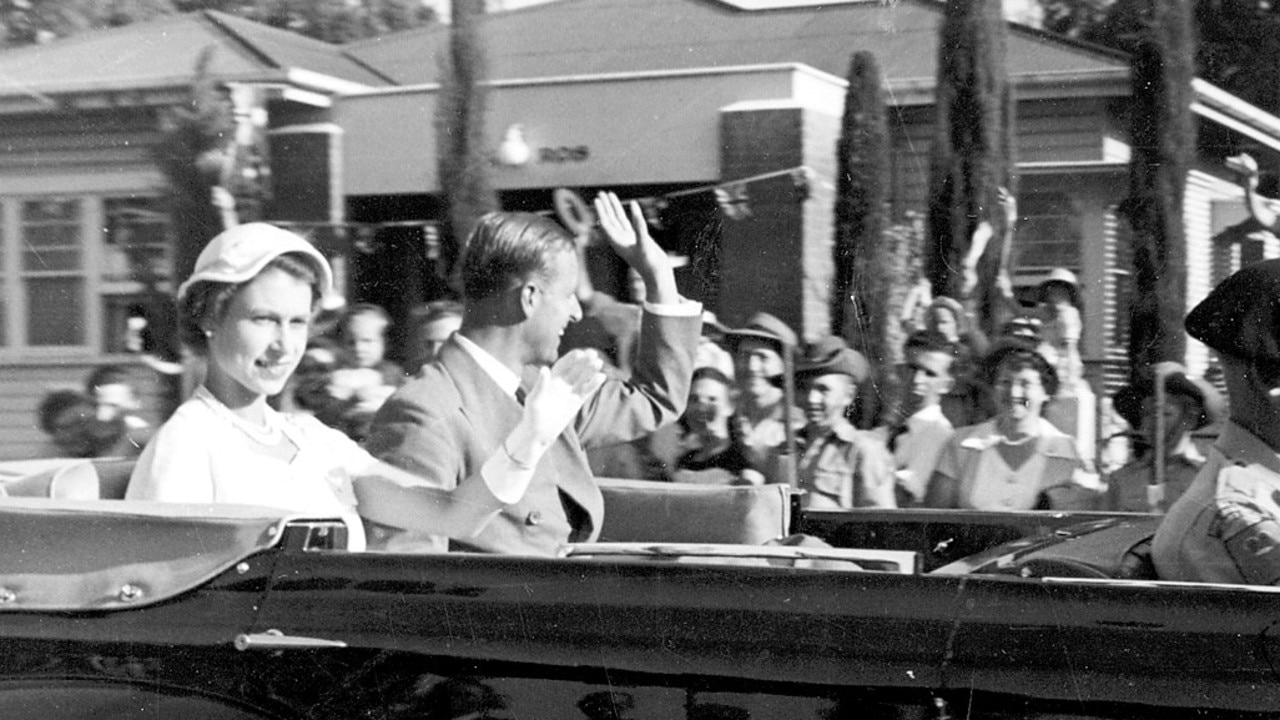 HER HIGHNESS'S ROYAL WAVE: Jack Parker took this photograph of Queen Elizabeth and Prince Phillip when they visited Australia as part of the 1954 Coronation Tour. It was taken as the couple toured James Street, Toowoomba. Photo: Contributed