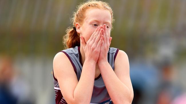 Tahnee Phillips (QLD) reacts while competing in the Girls U13 High Jump.