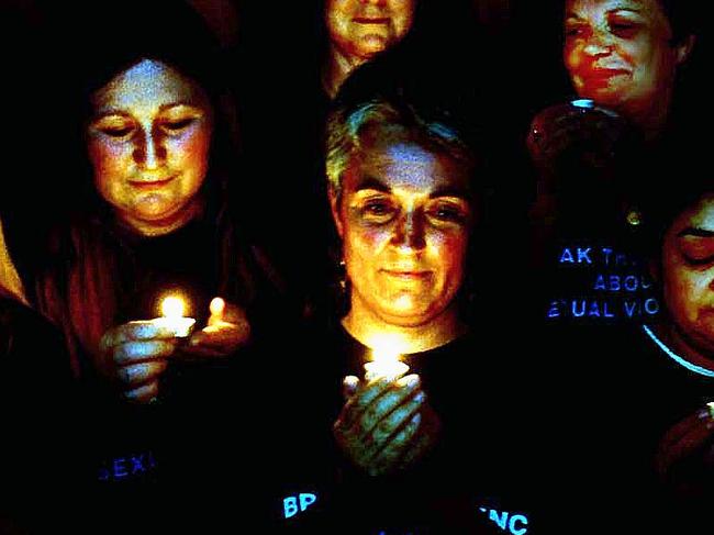 Women from the Penrith Womens Health Centre holding a candlelit vigil during the 'Day of Action Against Sexual Violence'. 26/8/99. Picture: david Hill