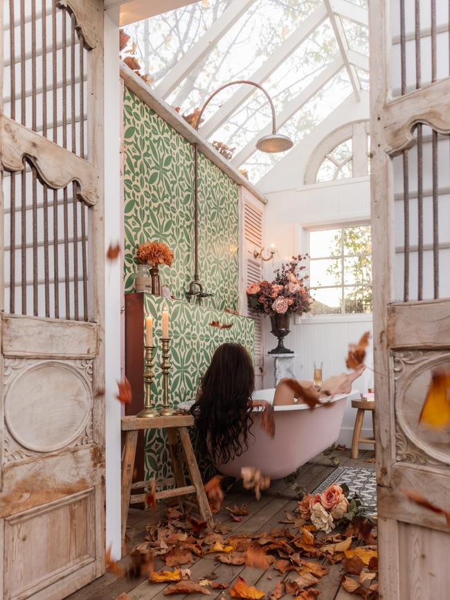 A guest relaxes in the outdoor bathing pavilion. Picture: Willow & Sage Photography