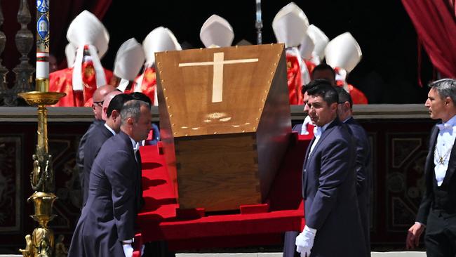 Pallbearers carry the coffin of late Pope Francis at the end of the funeral ceremony at St Peter's Square in the Vatican, on April 26, 2025. (Photo by Andreas SOLARO / AFP)