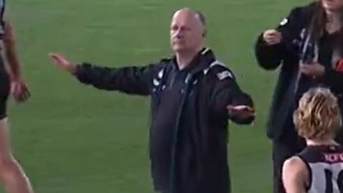 Ken Hinkley gestures to Jack Ginnivan that he won't be on a flight over this Insta reply 