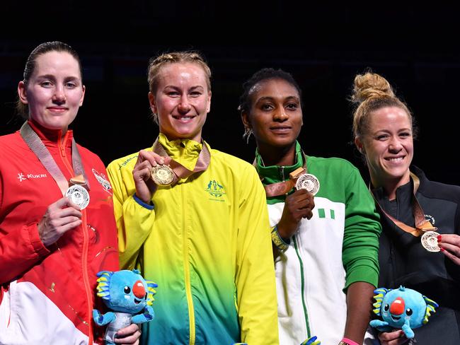 Silver medallist England's Paige Murney, gold medallist Australia's Anja Stridsman, and bronze medallists Nigeria's Yetunde Odunuga and New Zealand's Troy Garton. Picture: AFP Photo/Anthony Wallace