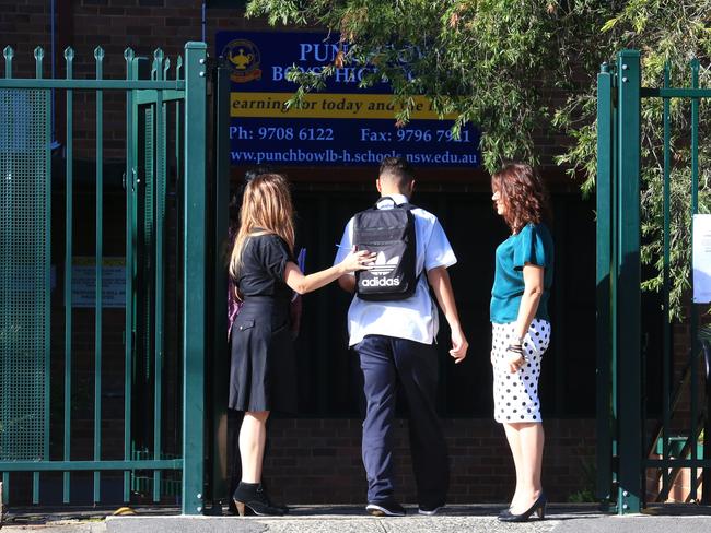 Teachers greeting the students on their way into the school. Picture: Adam Taylor