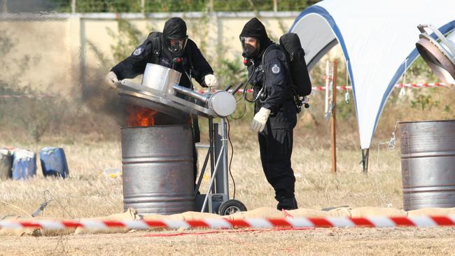 Authorities destroy 15 tonnes of safrole oil, which is a precursor to the illegal drug MDMA. Picture: AFP