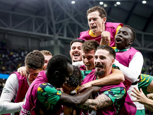 Mathew Leckie celebrates his goal with teammates. Picture: Eric Verhoeven/Soccrates/Getty Images