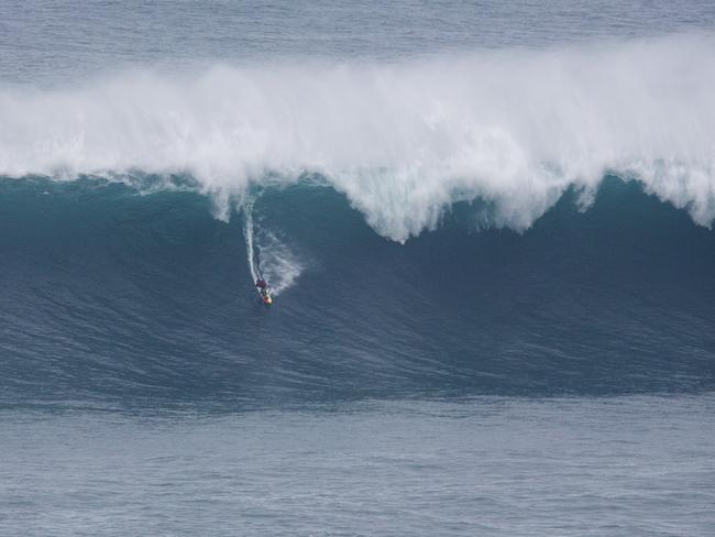 Ross Clarke Jones surfs a big wave at Praia do Norte in Nazare, Portugal on December 23, 2015. Picture: Red Bull.