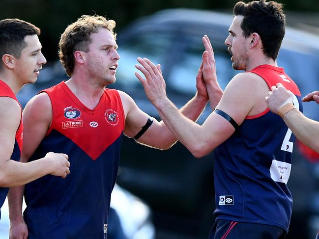 Tyler Barnes of Diamond Creek is congratulated by team mates after kicking a goal during the round 15 Northern Football Netball League 2023 MC Labour Division 2 Seniors match between Diamond Creek and Eltham at Coventry Oval in Diamond Creek, Victoria on July 29, 2023. (Photo by Josh Chadwick)