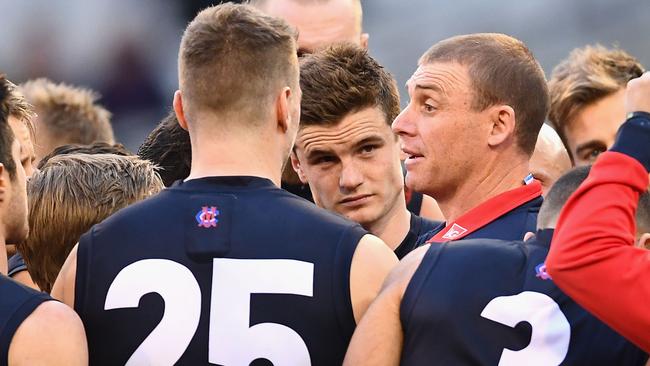 Simon Goodwin speaks to his players.