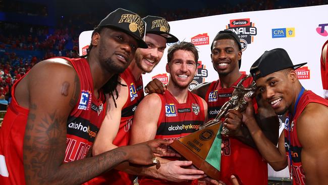 Jameel McKay, Angus Brandt, Damian Martin, Casey Prather and Bryce Cotton of the Wildcats pose with the trophy after winning game three and the NBL Grand Final series between the Perth Wildcats and the Illawarra Hawks at Perth Arena on March 5, 2017.