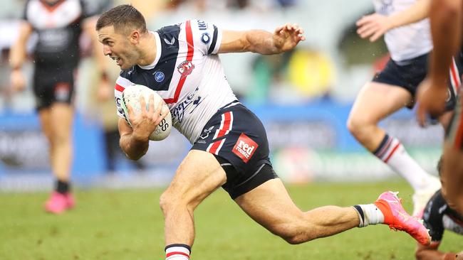 SYDNEY, AUSTRALIA - MARCH 21: James Tedesco of the Roosters breaks away to score a try during the round two NRL match between the Wests Tigers and the Sydney Roosters at Campbelltown Sports Stadium, on March 21, 2021, in Sydney, Australia. (Photo by Mark Kolbe/Getty Images)