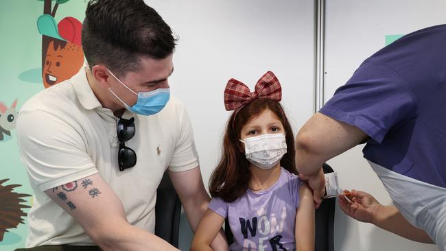 Alexa, 6, getting her injection with her dad Pat Harding. Picture: David Caird