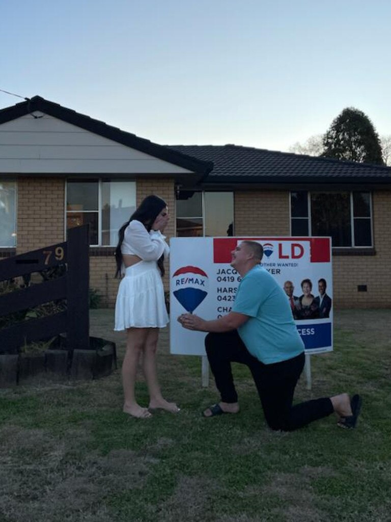 Aaliyah Suey received a surprise engagement from her fiance Tyler Hook at the handover of keys for their first home in Oakey, which was sold through Re/Max.