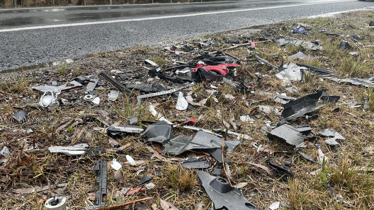 Broken glass and metal on the side of Cape Otway Rd on Tuesday morning following the crash.