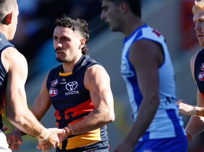 Izak Rankine of the Crows celebrates a goal with teammate Taylor Walker. (Photo by Dylan Burns/AFL Photos via Getty Images)