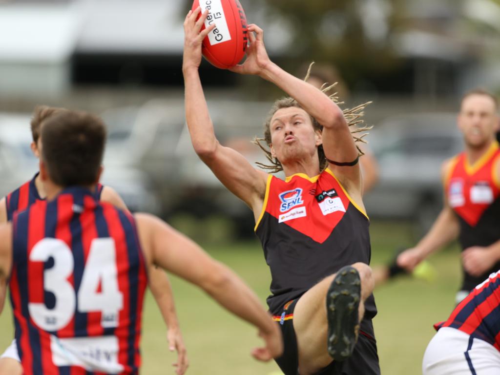 Southern: Lucas Walmsley takes a strong mark for Dingley against East Malvern. Picture: Stuart Milligan