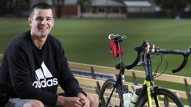 Port Adelaide player, Ryan Burton only recently started running again, after spending most of the AFL shutdown on his road bike. Picture Sarah Reed.