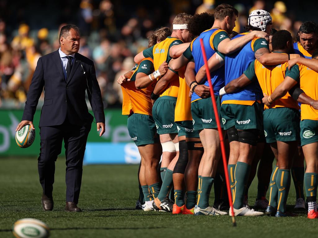 Former Wallabies coach Dave Rennie looks on as players huddle. Picture: Getty Images