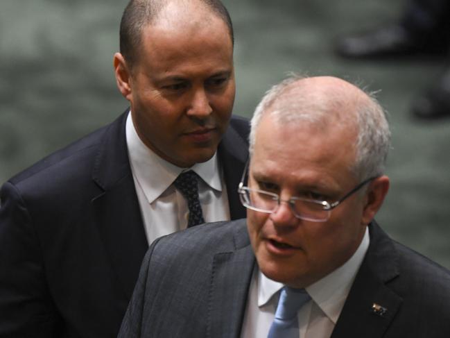 Australian Prime Minister Scott Morrison and Australian Treasurer Josh Frydenberg attend a parliamentary sitting under rules of social distancing in the House of Representatives at Parliament House in Canberra, Wednesday, April 8, 2020. (AAP Image/Lukas Coch) NO ARCHIVING