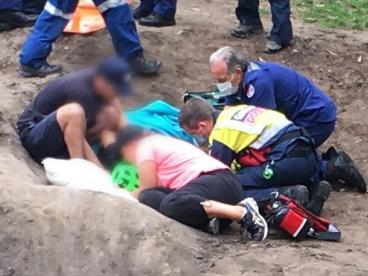 CareFlight  emergency helicopter medical crew and ambulance paramedics attend to a boy, 12, who suffered serious facial injuries after he fell from his bicycle while riding on a jump ramp in a reserve at Mona Vale. Picture: CareFlight