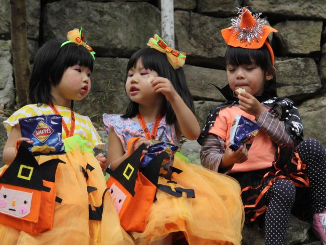 Children enjoy their spoils from trick or treating.