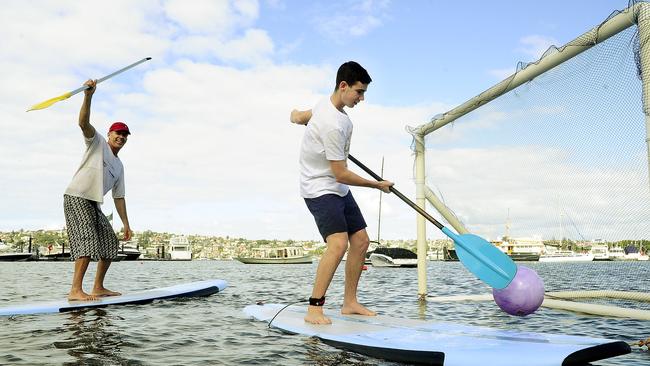 Lance O'Connor and Paul Strasser -17 playing Stand Up paddle Board Soccer in Rose Bay. SUP Soccer (Stand up Paddle board soccer) is starting at Rose Bay. Picture: John Appleyard