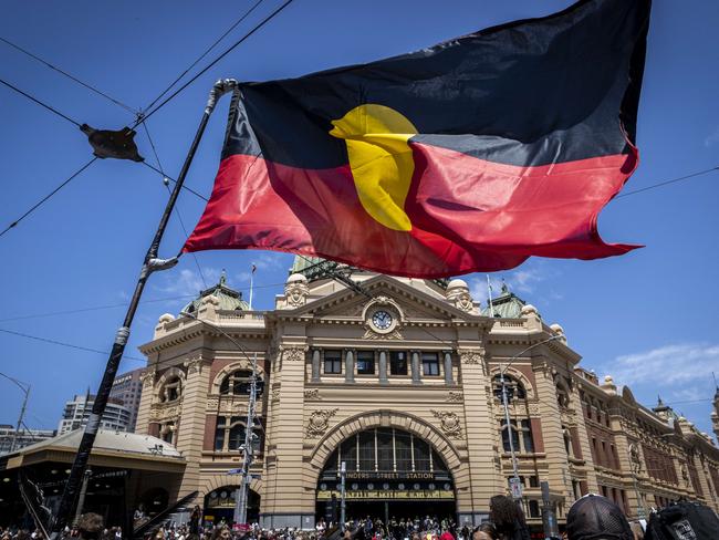 Invasion Day protest. Melbourne CBD. Australia Day. Protesters march through the CBD before rallying at Flinders Street Station. Picture: Jake Nowakowski