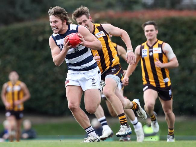 Tom Atkins of the Cats breaks away from Sam Gibson of the Hawks during the VFL match between Box Hill and Geelong played at Box Hill City Oval on Saturday 5th August, 2017. Picture: Mark Dadswell