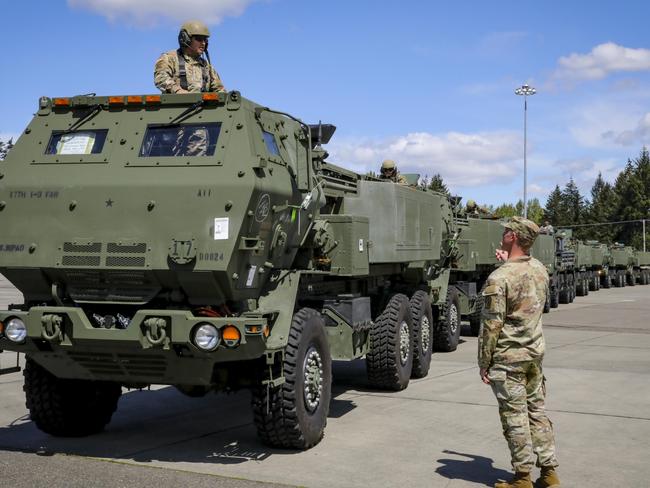 A HIMARS strike package vehicle commander from the US 17th Field Artillery Brigade on way to the Port of Tacoma in preparation for shipping the vehicles to Australia for Exercise Talisman Sabre