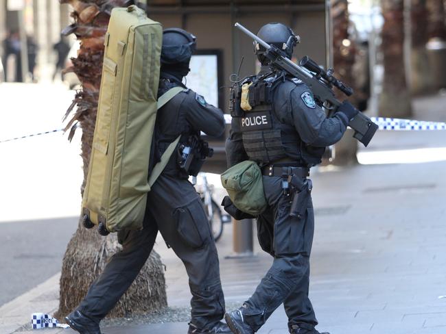 Heavily armed police at the scene of the Martin Place siege. Picture: Richard Dobson