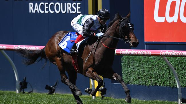 **RETRANSMISSION OF PHOTOGRAPH WITH ORIGINAL IMAGE ID 20181013001365895033-CAPTION CORRECTION-CORRECTING SPELLING OF JOCKEY'S NAME** Jockey Craig Williams rides Champagne Boom to victory in race 1, the Inglis Debutant Stakes during Caulfield Guineas Day at Caulfield Racecourse in Melbourne, Saturday, October 13, 2018. (AAP Image/Julian Smith) NO ARCHIVING