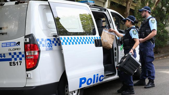 Police carry evidence bags outside the home of Jessie Baird in Paddington in Sydney on Friday. Picture: NCA NewsWire / Gaye Gerard