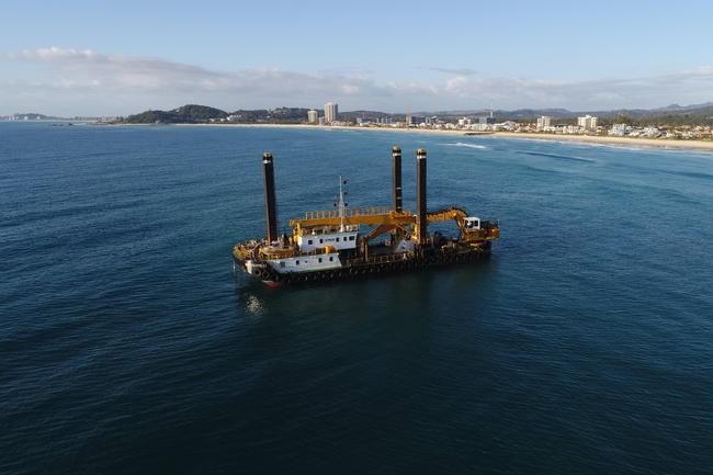 The giant Rock Dredge works on the Artificial reef just offshore from Nineteenth Ave Palm Beach. Picture Glenn Hampson