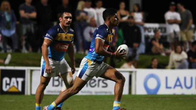 Gold Coast Titans winger Alofiana Khan-Pereira runs the ball during a pre-season trial against Burleigh Bears at Pizzey Park. February 20, 2021. Photo Jason O'Brien