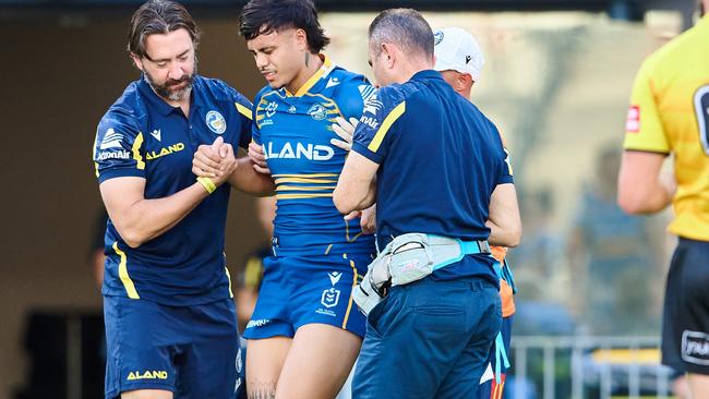 Haze Dunster is helped from the field after injuring his knee against the Dragons during a pre-season hitout.