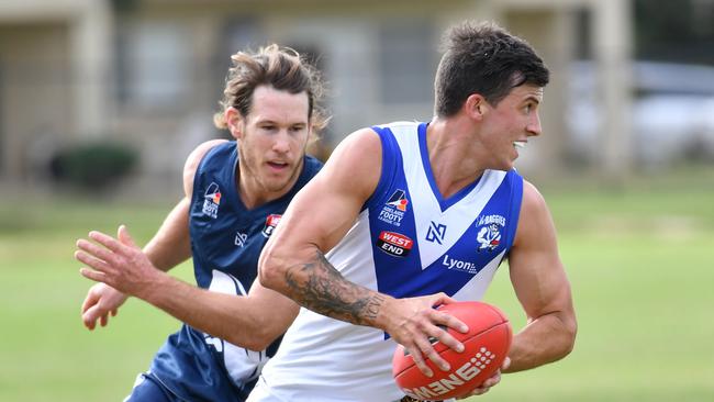 AMATEUR FOOTY: Henley (blue) v Athelstone (White)photograph at Henley Beach, Adelaide on Saturday the 26th of May 2018. H- Michael Gautesen v A - Jake Westover (AAP/ Keryn Stevens)