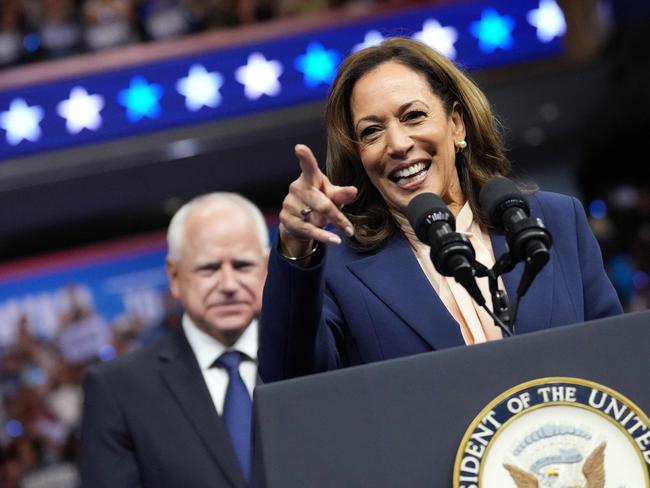 Vice President Kamala Harris speaks as Democratic vice presidential candidate Minnesota Governor Tim Walz looks on. Picture: Getty Images