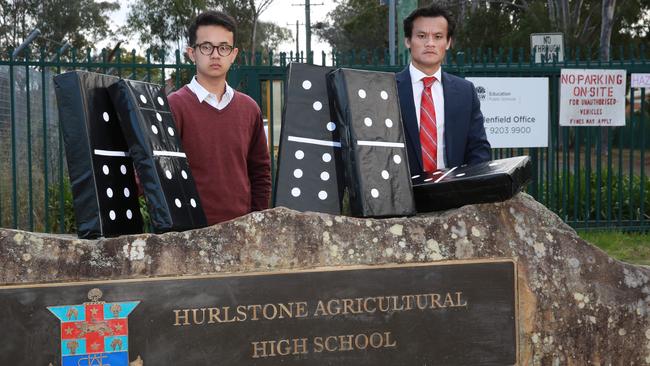 Macquarie Fields state Labor MP Anoulack Chanthivong with Campbelltown Young Citizen of the Year and Hurlstone graduate Adam Herman concerned about the future of the school. Picture Damien Shaw