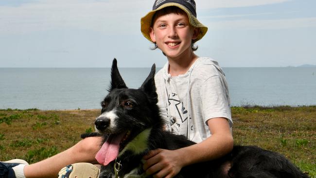 Aiden Wheelhouse, 11, with Dexter tries to keep cool on the Strand. Picture: Evan Morgan