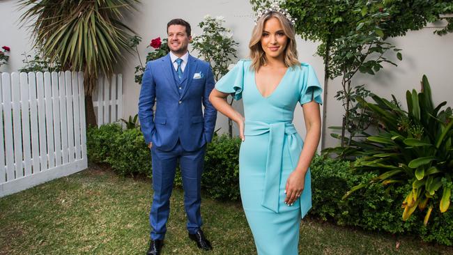 Olivia Molly Rogers her fiance Justin McKeone at home in Glen Iris wearing their Melbourne Cup outfits. Picture: Paul Jeffers