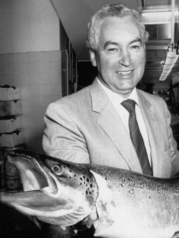 Bruce Goodluck with a salmon he took to Federal Parliament.