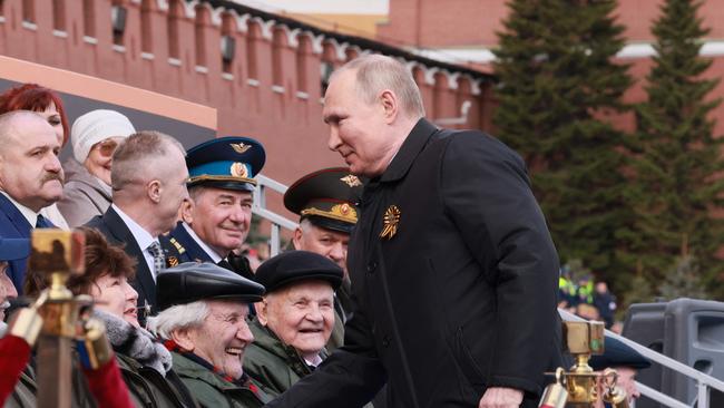 Vladimir Putin greets veterans as he arrives to watch the Victory Day military parade. Picture: Mikhail Metzel / Sputnik / AFP