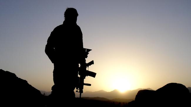 A soldier watches the valley during a joint Afghan-Australian operation to clear a Taliban insurgent stronghold. Picture: Department of Defence