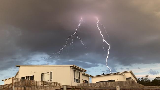 Lightning strikes over a home at Old Beach on Hobart's Eastern Shore. Reader's picture: NICK WOODWARD